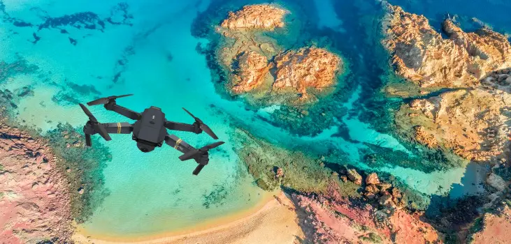 Stealth Bird 4K above a stunning coral beach